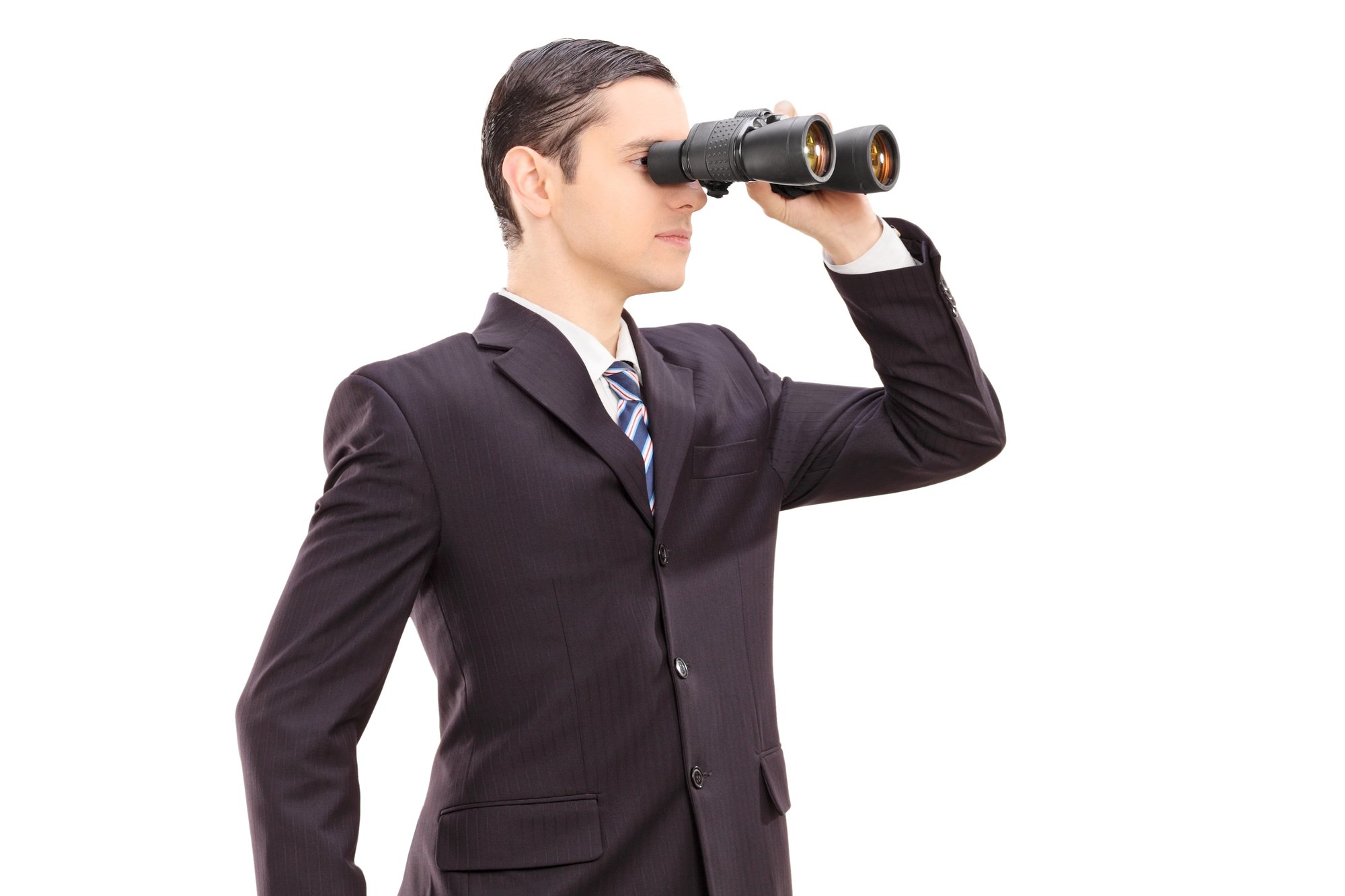Businessman looking through binocular
