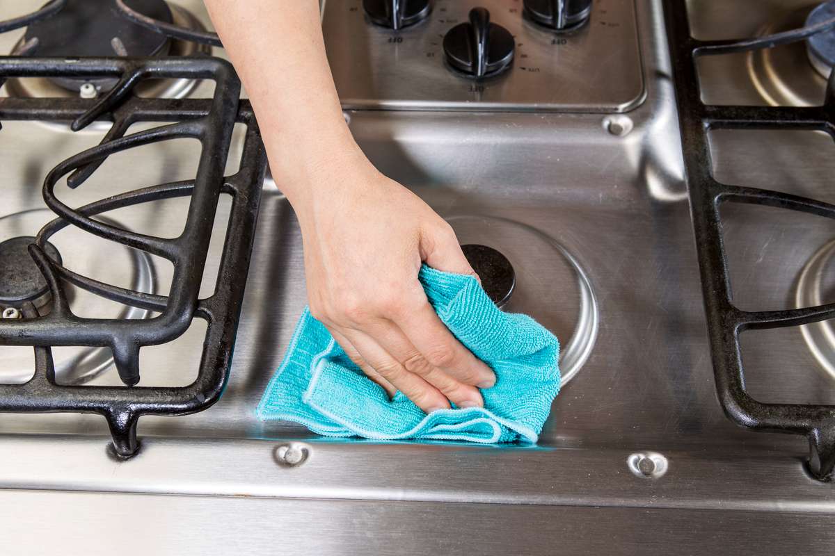 Wiping down Stove top Range (R) (S)