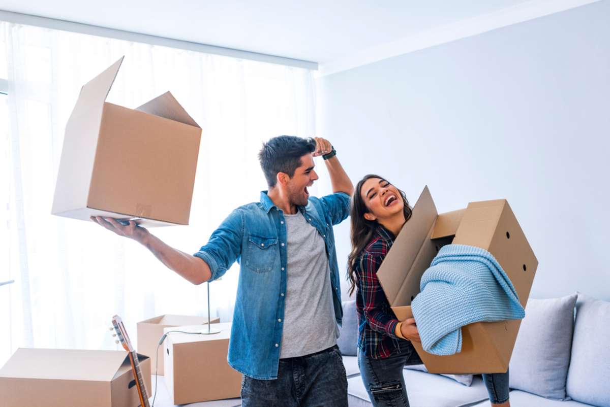 young couple enjoy and celebrating moving to new home